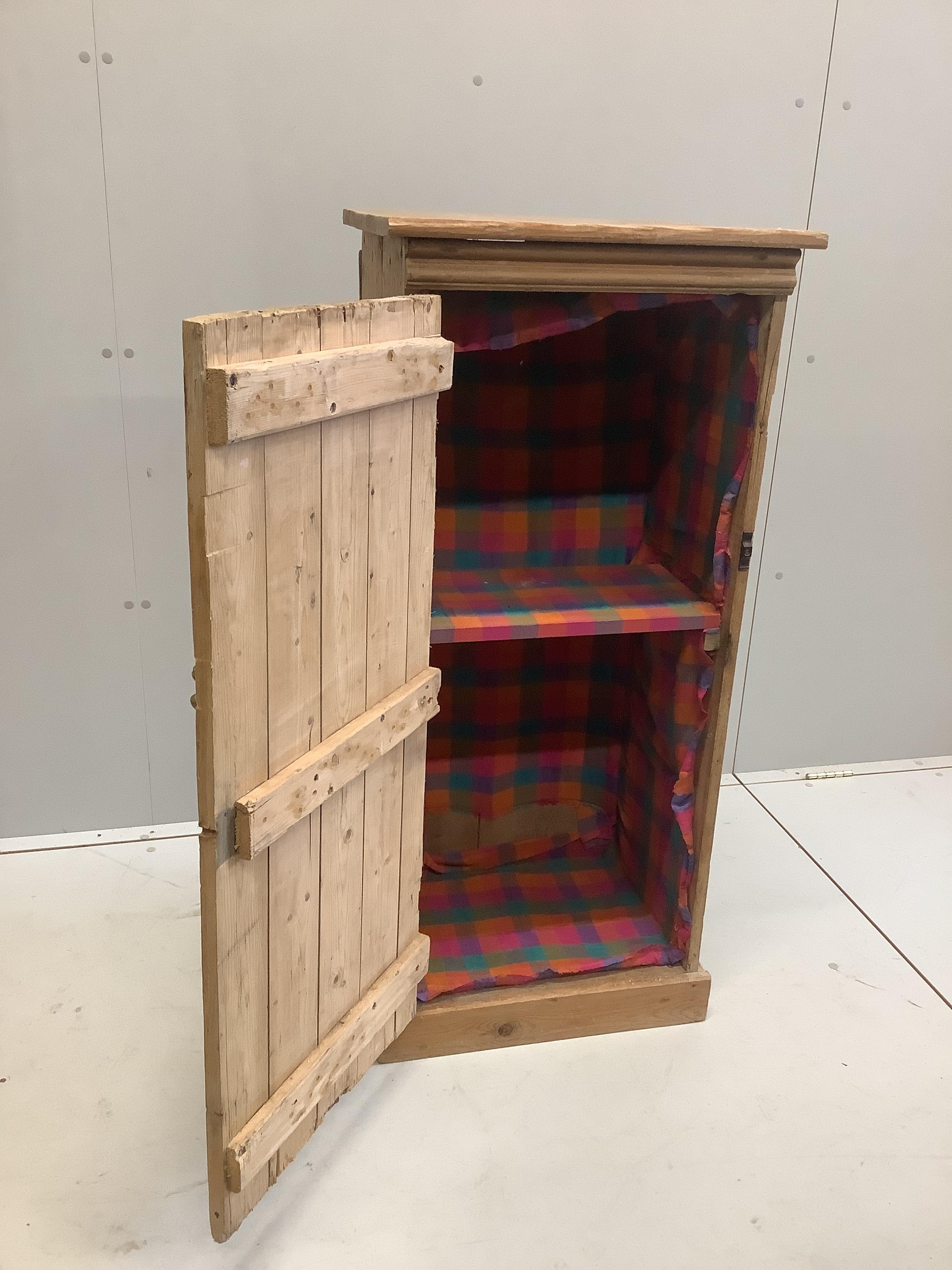 A narrow pine single door cabinet, width 52cm, depth 37cm, height 113cm